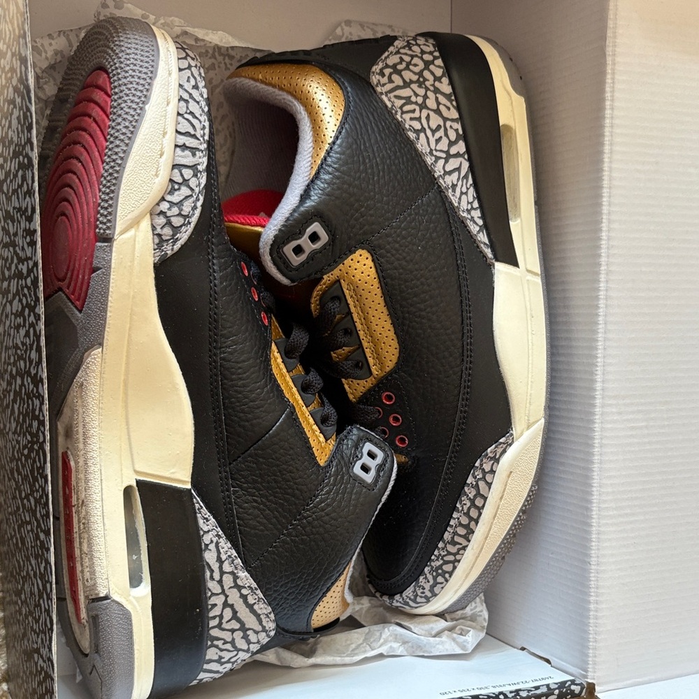 Jordan Black and Gold Sneakers